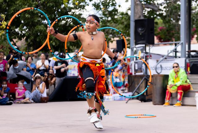 A hoop dancer performs at Indian Market.