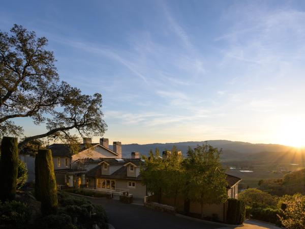The sun sets over the hills in the Stags Leap District near Napa Valley's Poetry Inn.
