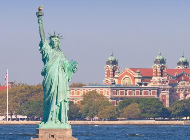 Ellis Island and the Statue of Liberty on a sunny day in New York City