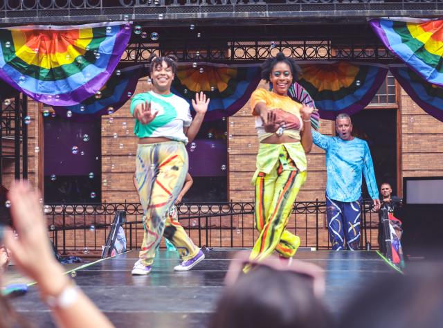 Two people dance on stage at Southern Finger Lakes Pride