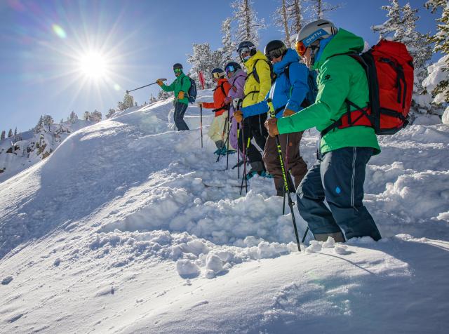 Skiers enjoy a beautiful powder day on the Wasatch Interconnect Tour