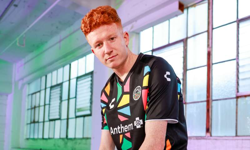 Oakland Roots player showing off the new team jersey