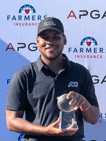 Marcus Byrd displays his APGA Tour Valley Forge trophy after winning the second annual championship Wednesday at Bluestone Country Club in Blue Bell, Montgomery County, PA.