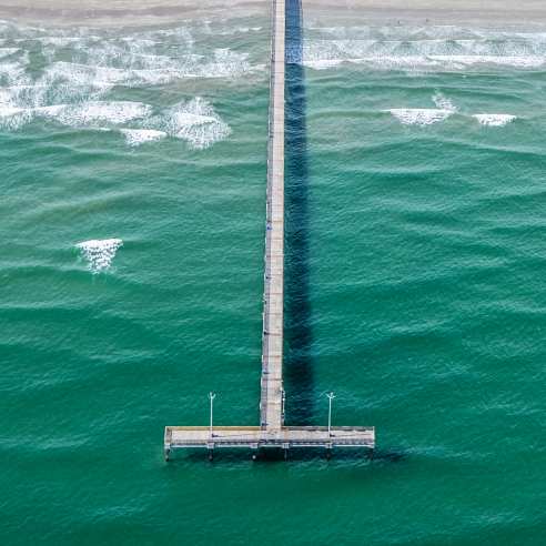 Aerial view of the Horace Caldwell pier at the beach