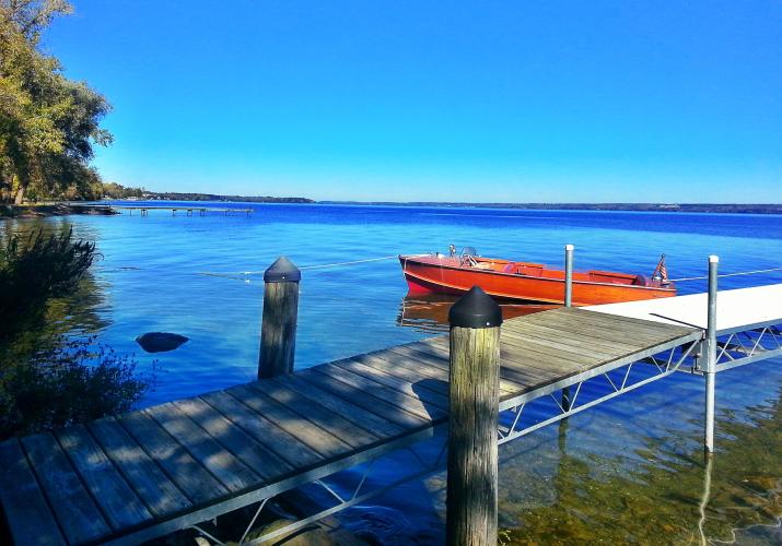 Dock with tied up boat on Cayuga Lake