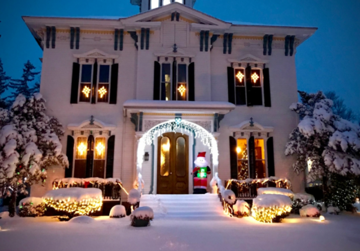 View of Tillinghast Manor at night with holiday lights
