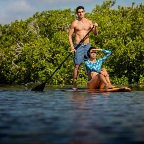 Paddleboarding together is a romantic adventure.
