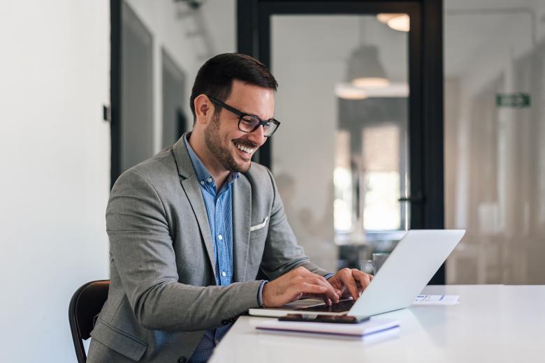 Man sitting at a laptop