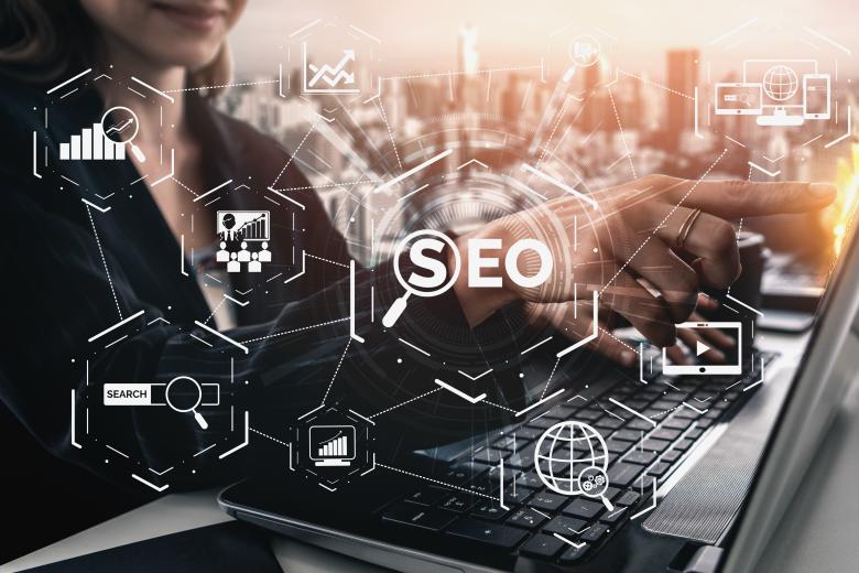woman at laptop with SEO graphic