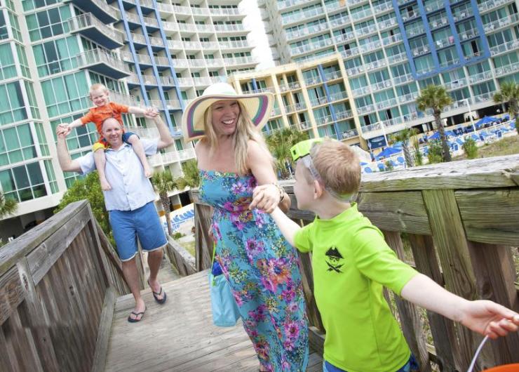 Family Walking Along North Myrtle Beach Boardwalk