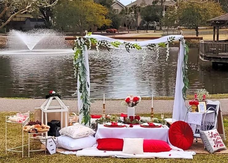 A wedding reception overlooking a pond in McClean Park