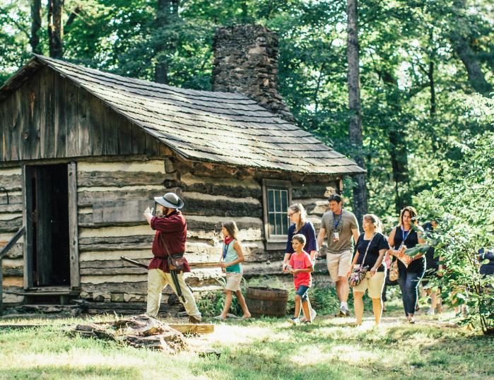 Hickory Ridge Museum docent leads a group of visitors.