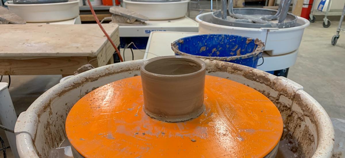 Wet clay Cup on Potter's wheel