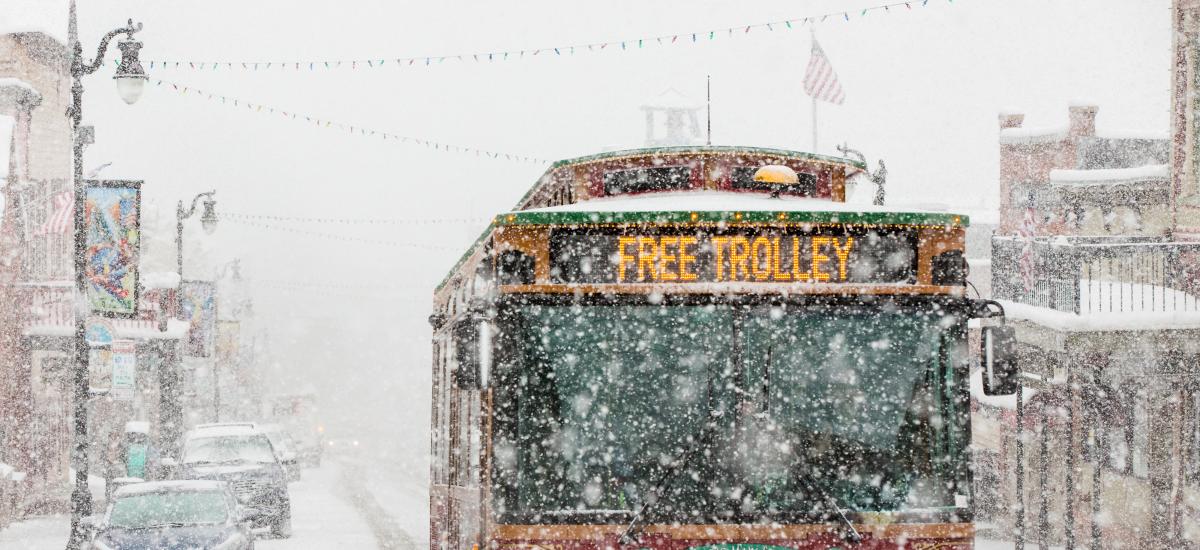 Free Trolley driving up Historic Main Street in a snow storm