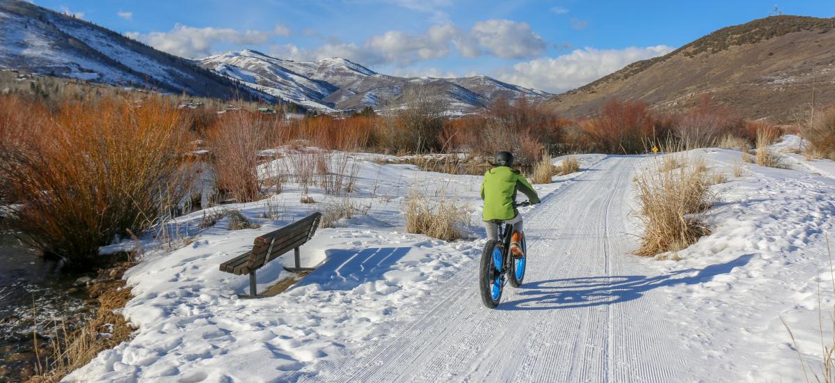 Person riding an Electric Fat Tire Bike on snow covered bike path