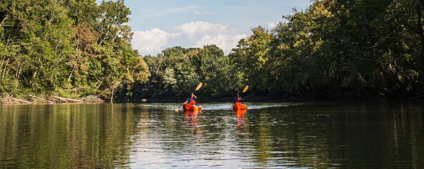 Friends enjoy a day of kayaking along the quiet waters of the Saluda River outside of Columbia, SC.