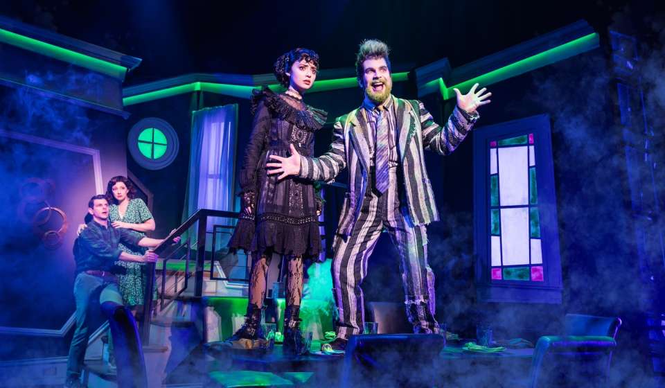 Beetlejuice and Lydia pictured on stage in "Beetlejuice"
