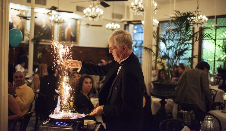 An Arnaud's employee sets fire to a pan to make café brulot