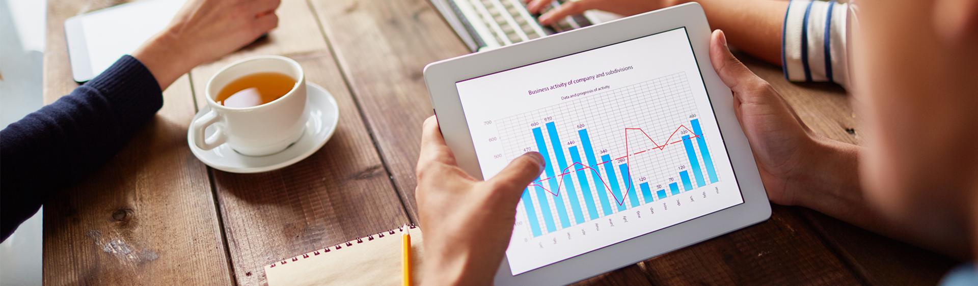 Stock photo of group of employees working on a presentation.
