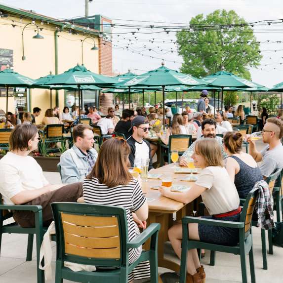 A large group dining on Upland's patio