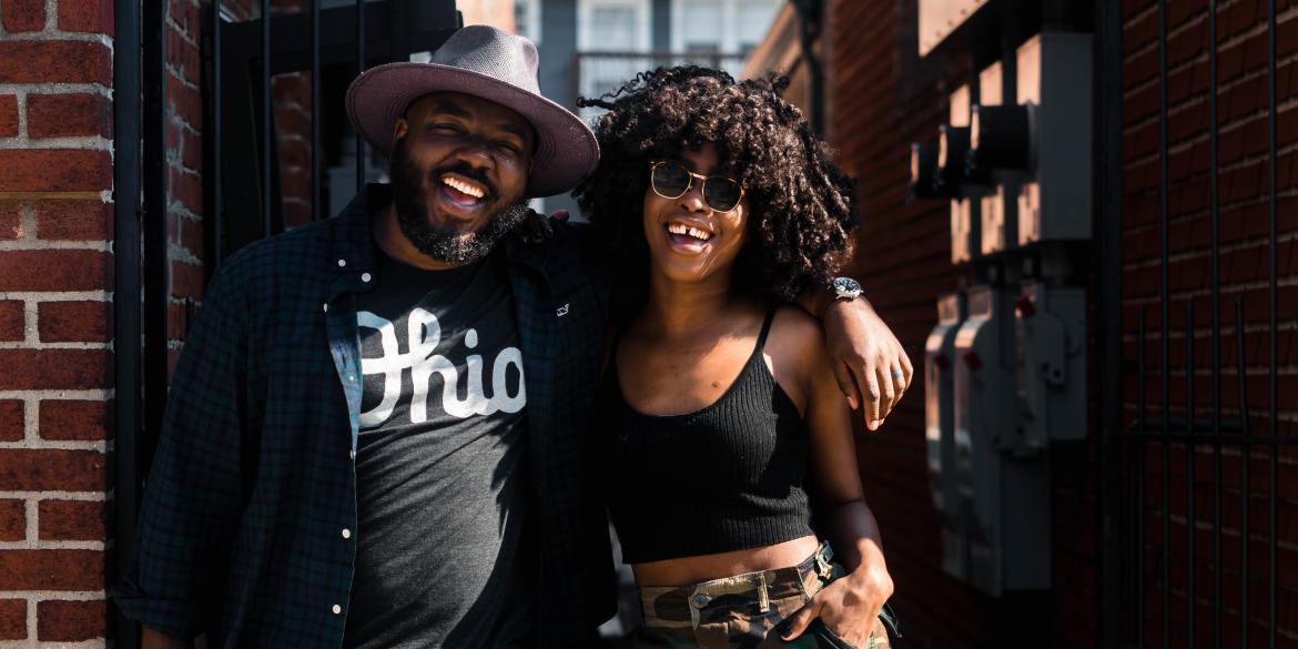Black man and woman smiling