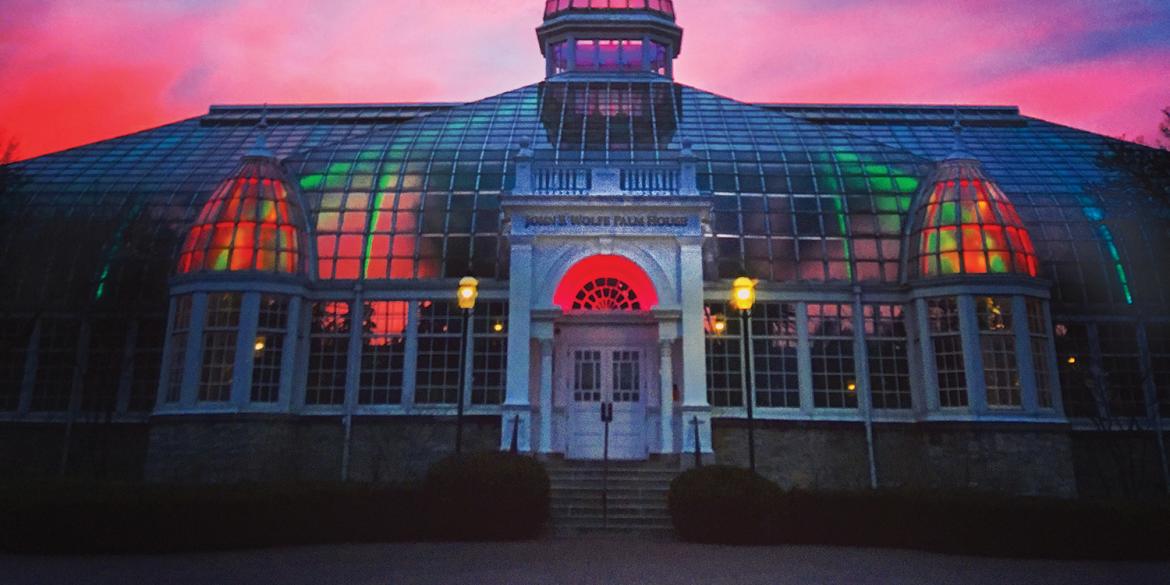 A sunset photo of the John Wolfe Palm house at the Franklin Park Conservatory and Botanical Gardens.