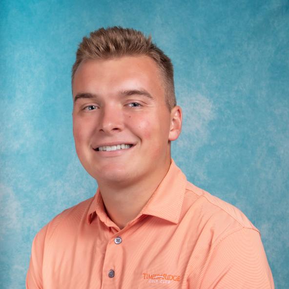 Man in front of blue background