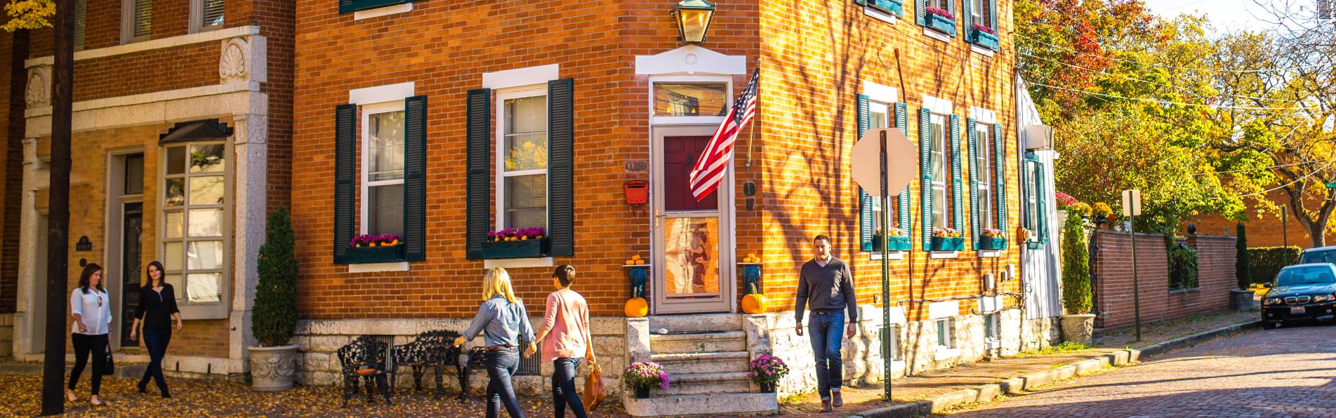 People walk in Columbus' German Village neighborhood in the fall