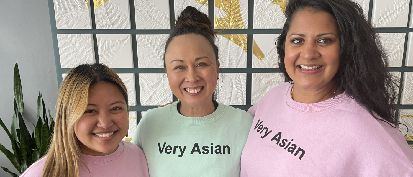 Three women wearing sweatshirts that say "Very Asian"