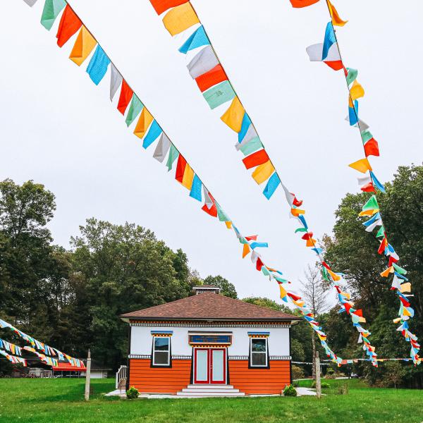 Prayer flags and a building at the Tibetan Mongolian Buddhist Cultural Center