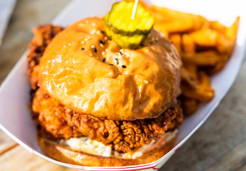 Fried chicken sandwich topped with pickles