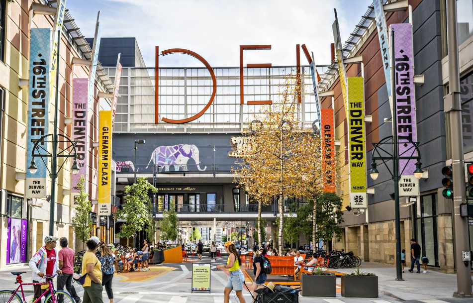 People walking outside the Denver Pavilions on the 16th Street pedestrian promenade.