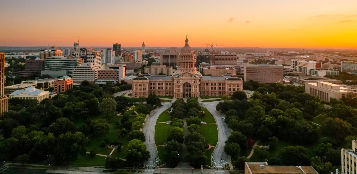 Sunrise aerial view of the Texas State Capitol grounds.