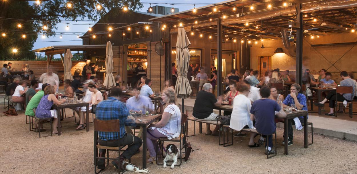 people dining in the beer garden at Contigo in east austin texas