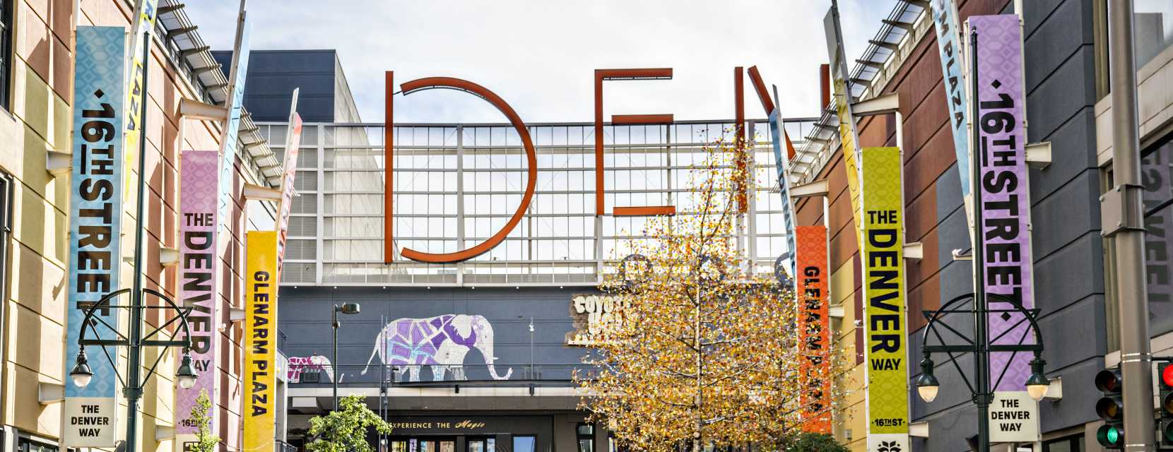 People walking outside the Denver Pavilions on the 16th Street pedestrian promenade.