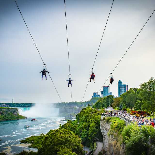With four parallel ziplines facing the American Falls and the mighty Canadian Horseshoe Falls, riders dangle from a thrilling 67 metres (220 feet) high above the Niagara River at the WildPlay Zipline