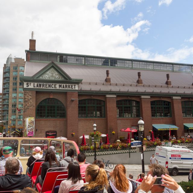 A view of the exterior of St Lawrence Market from a tour bus in summer
