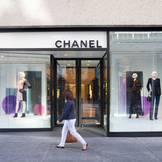 A woman walks past the Chanel store in Toronto's Yorkville neighborhood