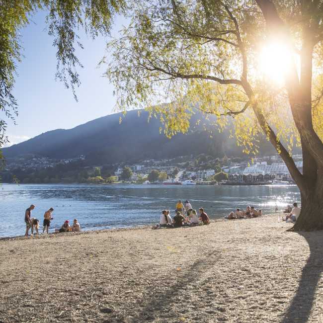 People sitting on Queenstown Bay