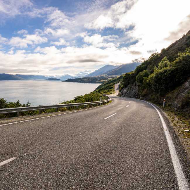 Iconic Queenstown Glenorchy Road with lake and mountain views