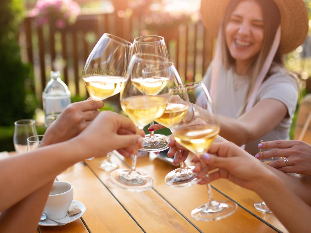friends cheers with white wine