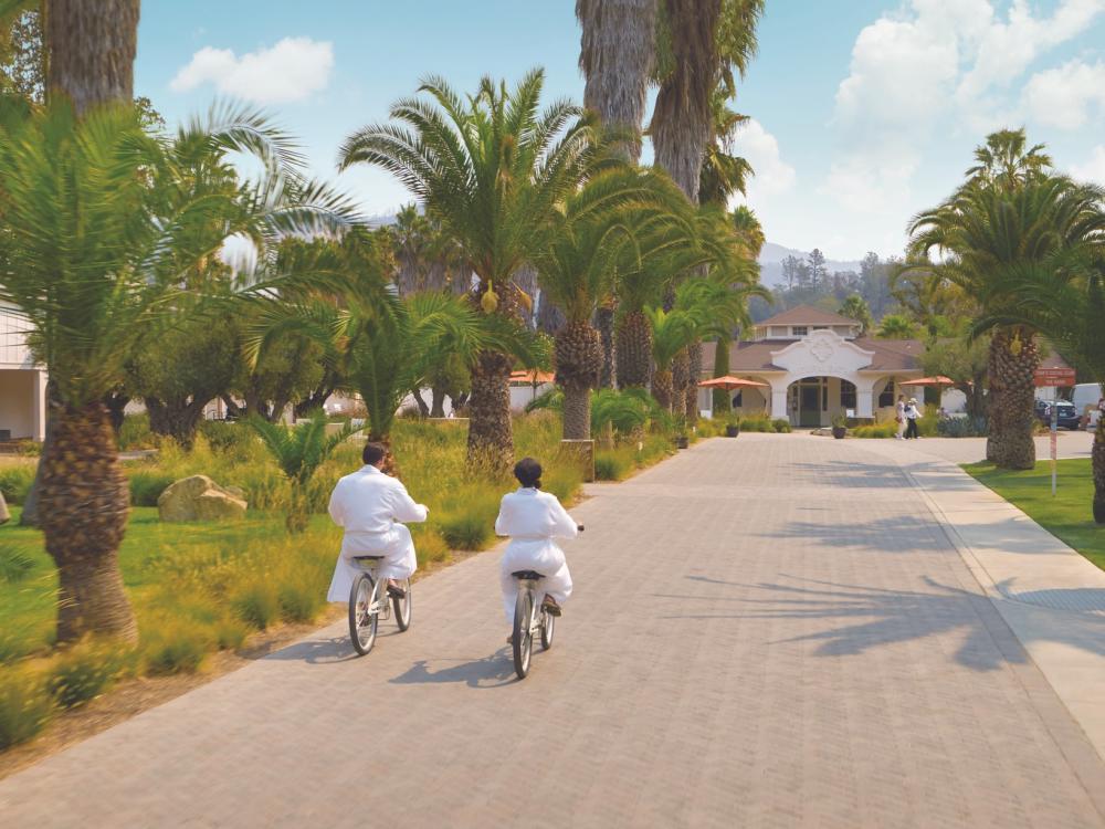 Couple riding biking to the Indian Springs spa