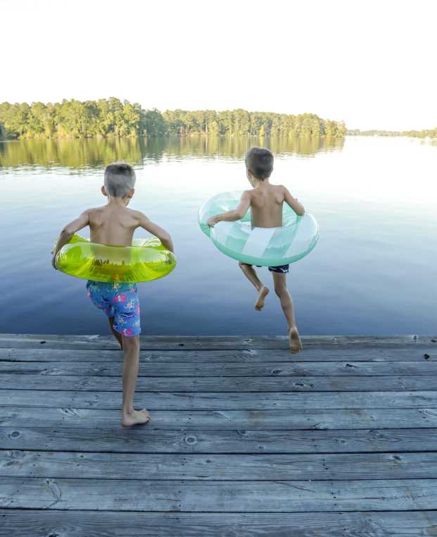 Lake Sinclair boys jumping with floats