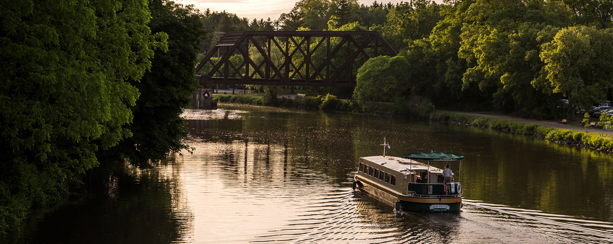 A boat sailing along the Erie Canal in Pittsford, NY