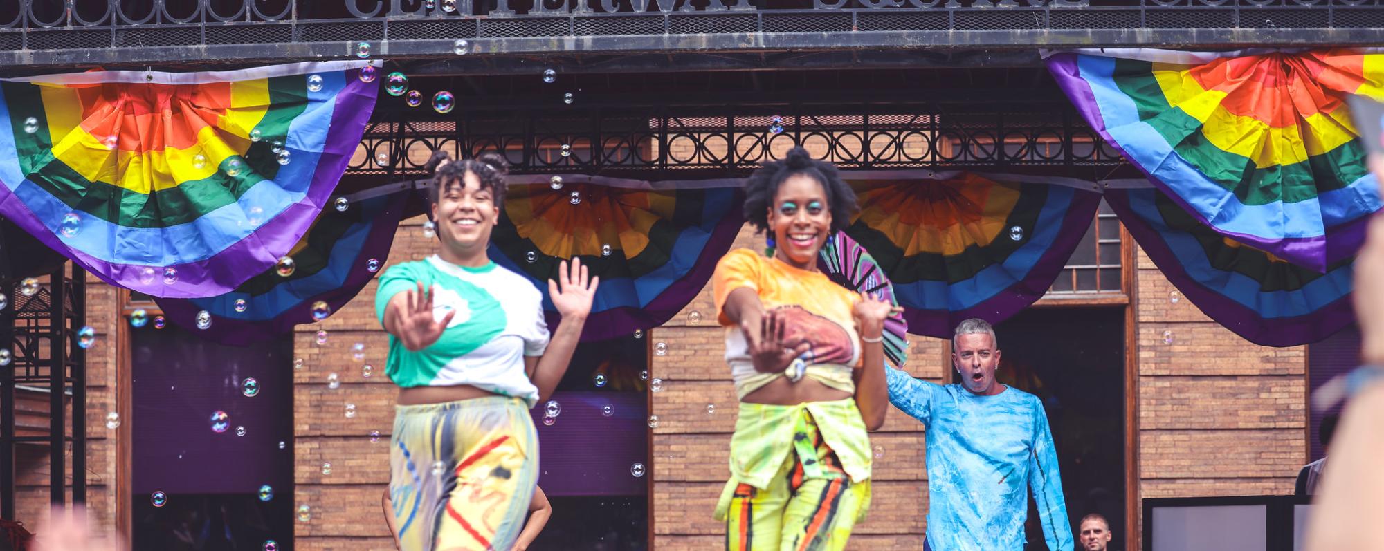 Two people dance on stage at Southern Finger Lakes Pride
