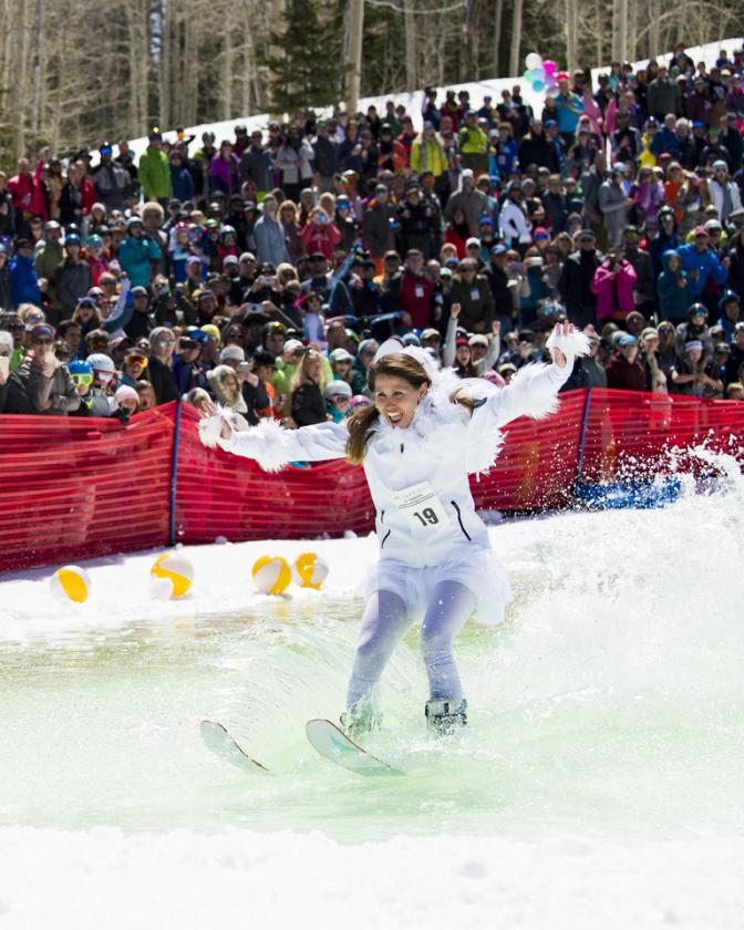 Lady in Bird costume attempts to skim across water on skis