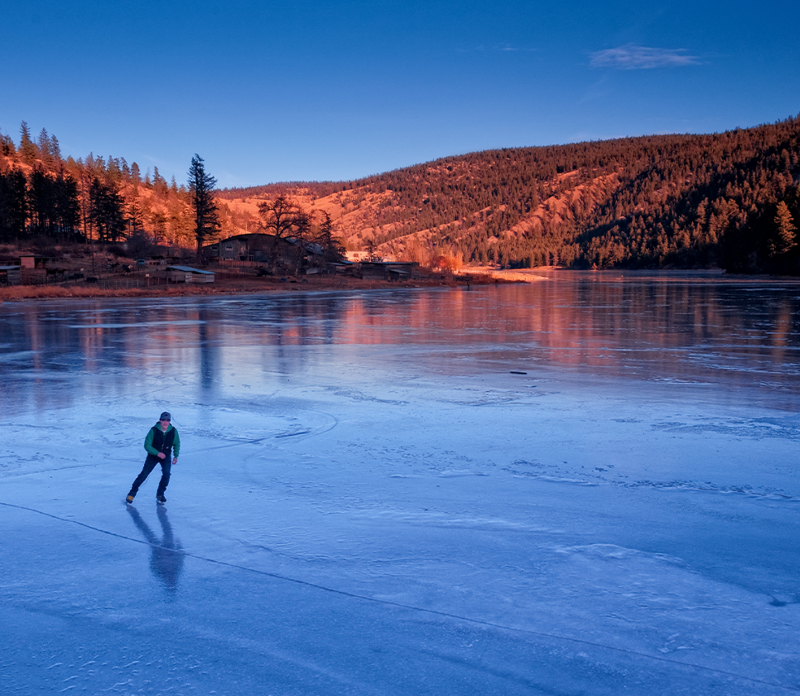 Ice fishing on Heffley Lake near Sun Peaks Resort with Elevated Fishing  Adventures. The lake is stocked with rainbow trout, a mild fish that makes  great eating. This ice fishing tent and