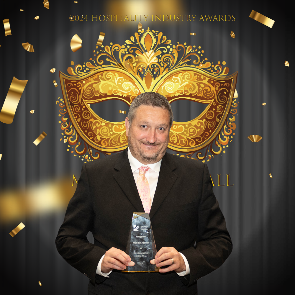 Wayne Moore of D.H. Lescombes Winery and Bistro with the 2024 Restaurateur of the Year Award.