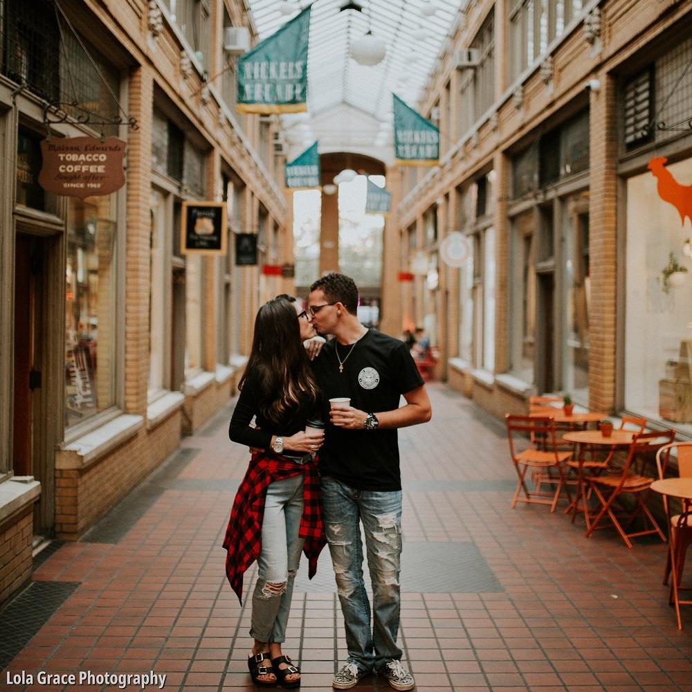 Couple kissing at Nickels Arcade