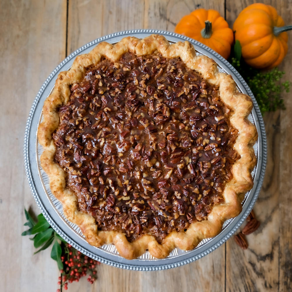 Close up picture of a pecan pie.